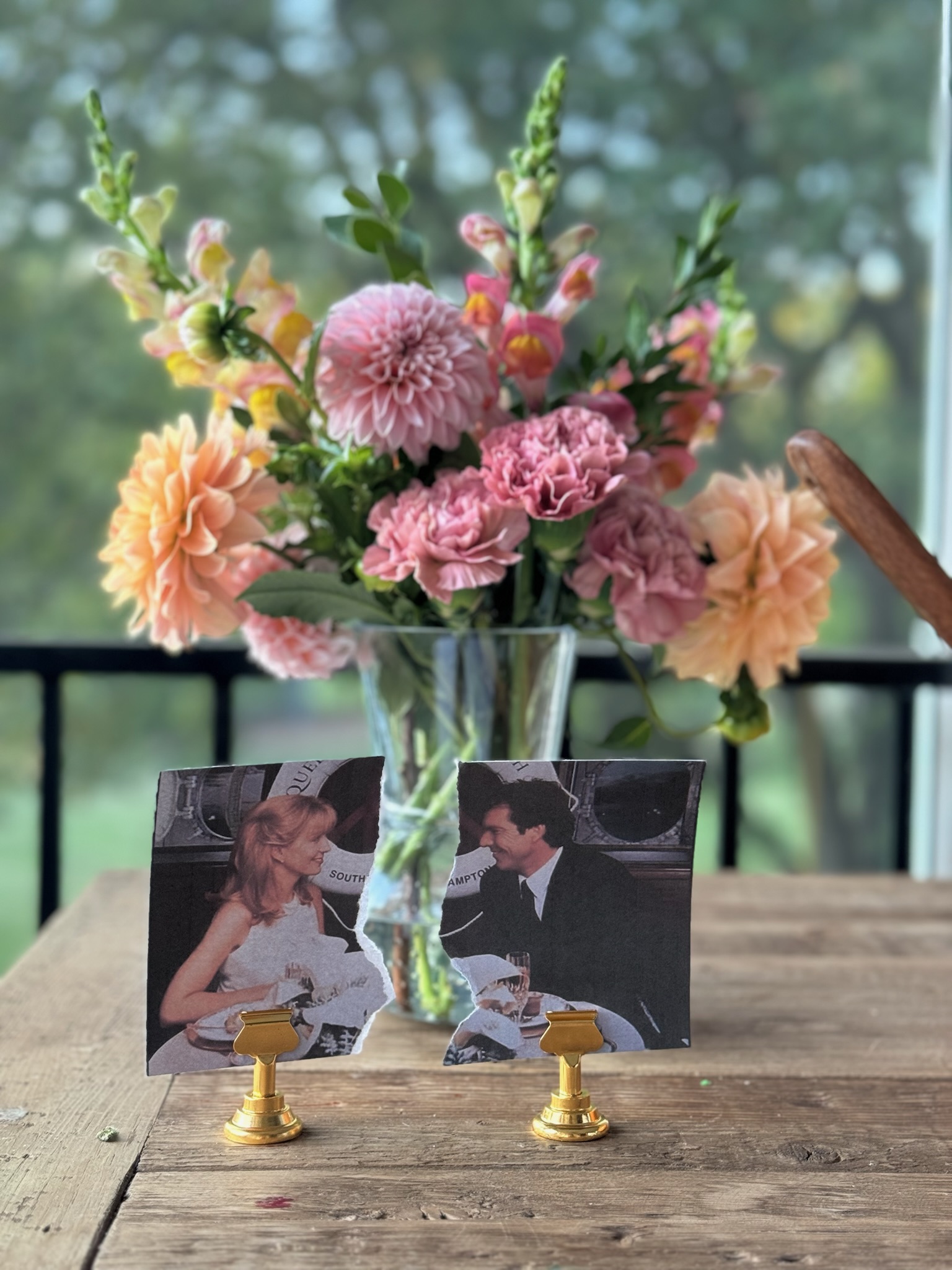 a wedding photo from the parent trap with a floral arrangement behind it